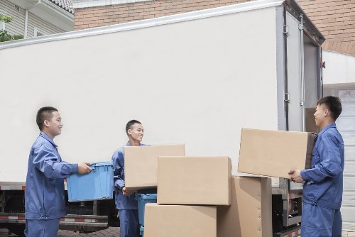 Professional movers loading furniture for a Bayswater home relocation