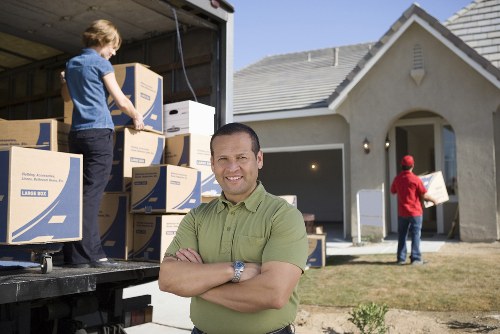 Local movers handling boxes and furniture near Bayswater flats