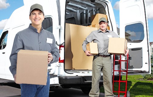 Loading furniture into a van for a local removal