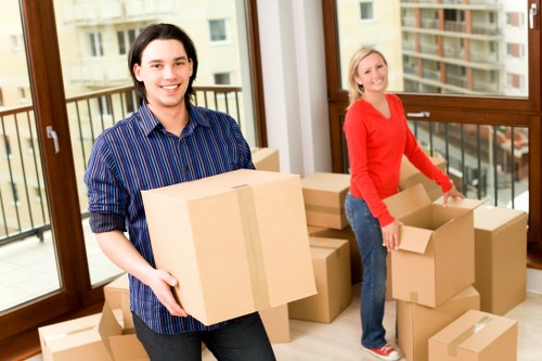 Removal team loading furniture in central London